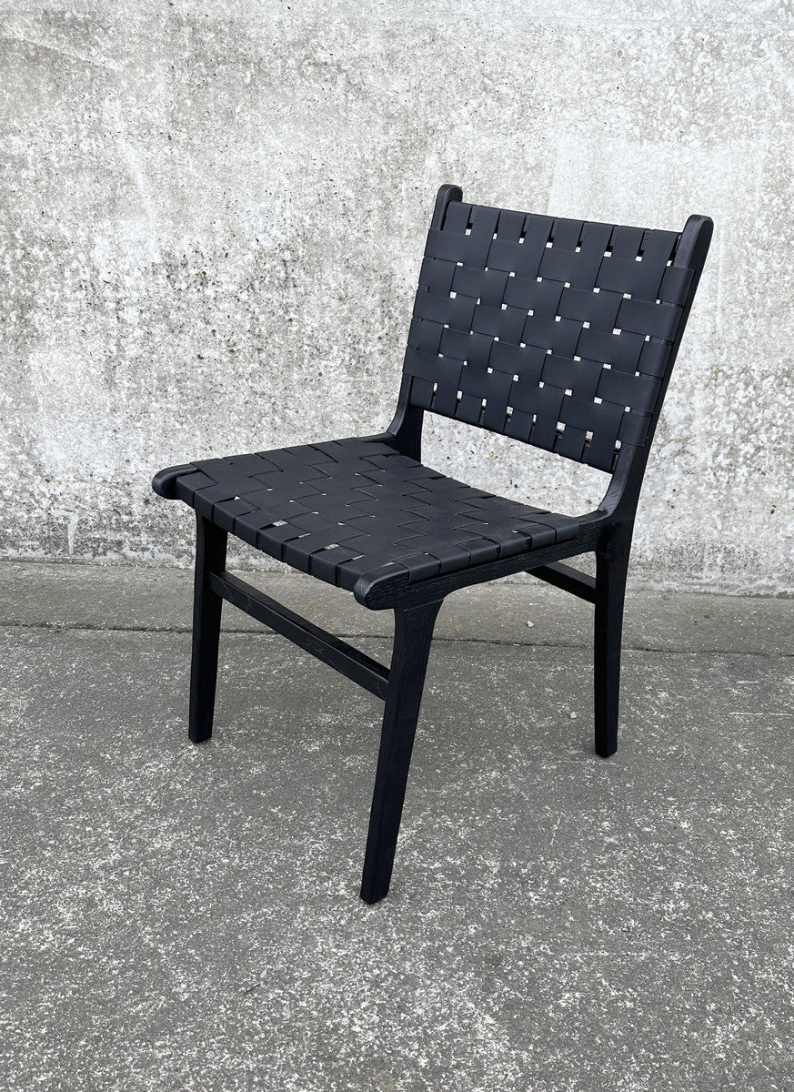 This London Dining Chair in Black from Chambers Design Timaru boasts a robust frame constructed from natural Fir wood,