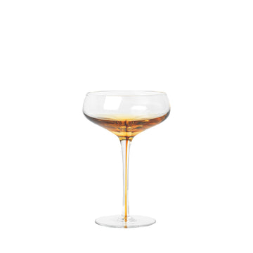 The Amber Cocktail Glass is apart of the smoke collection. inspired by the rich golden colour of amber,