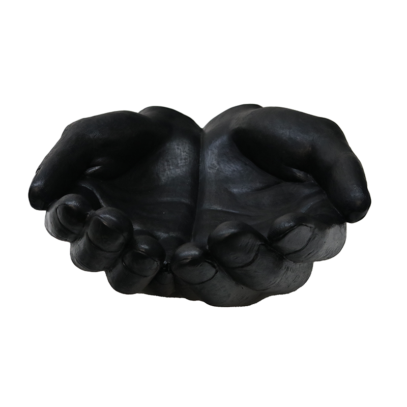 The hand sculpture from Le Forge is crafted from resin and finished in an ebony black,