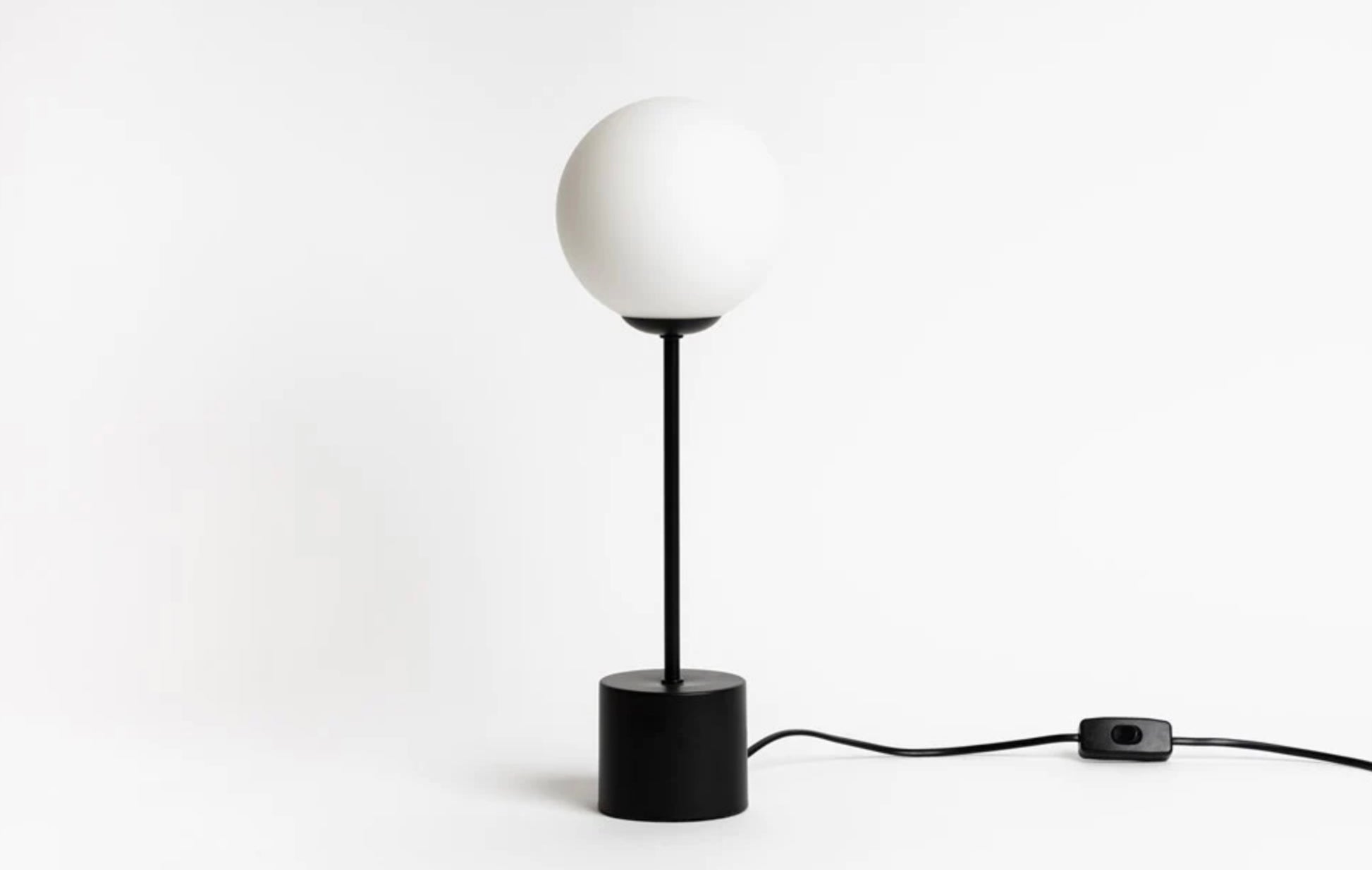 The Orb Lamps, available in multiple elegant and modern shapes. Simple organic forms offering a soft glow.   Powder coated steel in black with hand blown frosted glass. Line on/off switch.  Available now at Chambers Design.