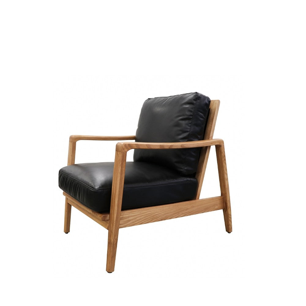 A laid-back contemporary armchair, the Reid is as comfortable as it looks slick.  The one of a kind backrest features joined canvas and leather straps held together with a brass buckle, making for a bit of wow factor - especially if the back of the chair is visible for all to see.