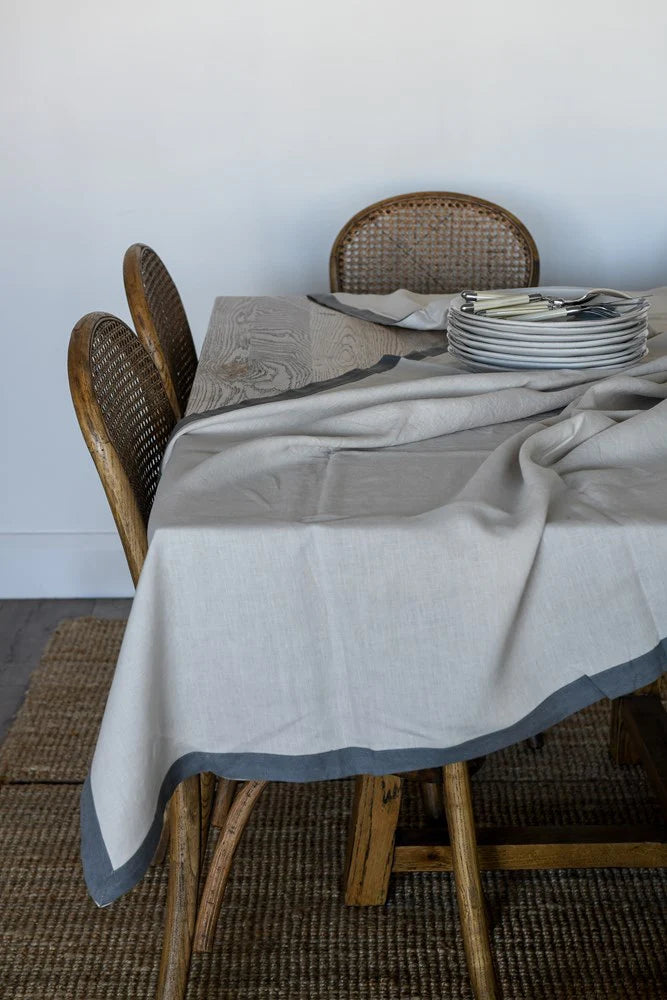 Chambers Design is delighted to bring you an elegant table cloth from Raine & Humble. Dining perfection - White linen table cloth with a tape border. The boarder adds a little extra texture and elevating it to the next level of sophistication.  Measures 140x250 cm