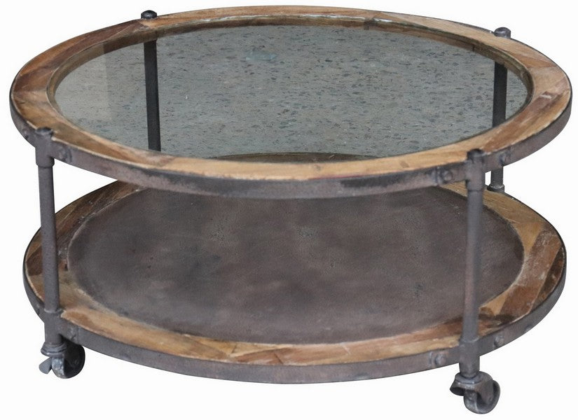 This Industrial inspired table from Chambers Design is a master class in functionality and style. A round glass top coffee table framed with reclaimed elm and antique iron. The wheels add novelty and movability while the weathered details add a vintage touch.  Perfect for home or offic