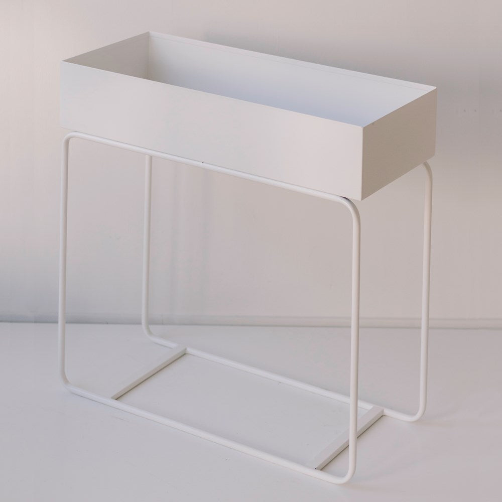 Metal Planter is the tall powder-coated stand & set on a slender yet sturdy frame.