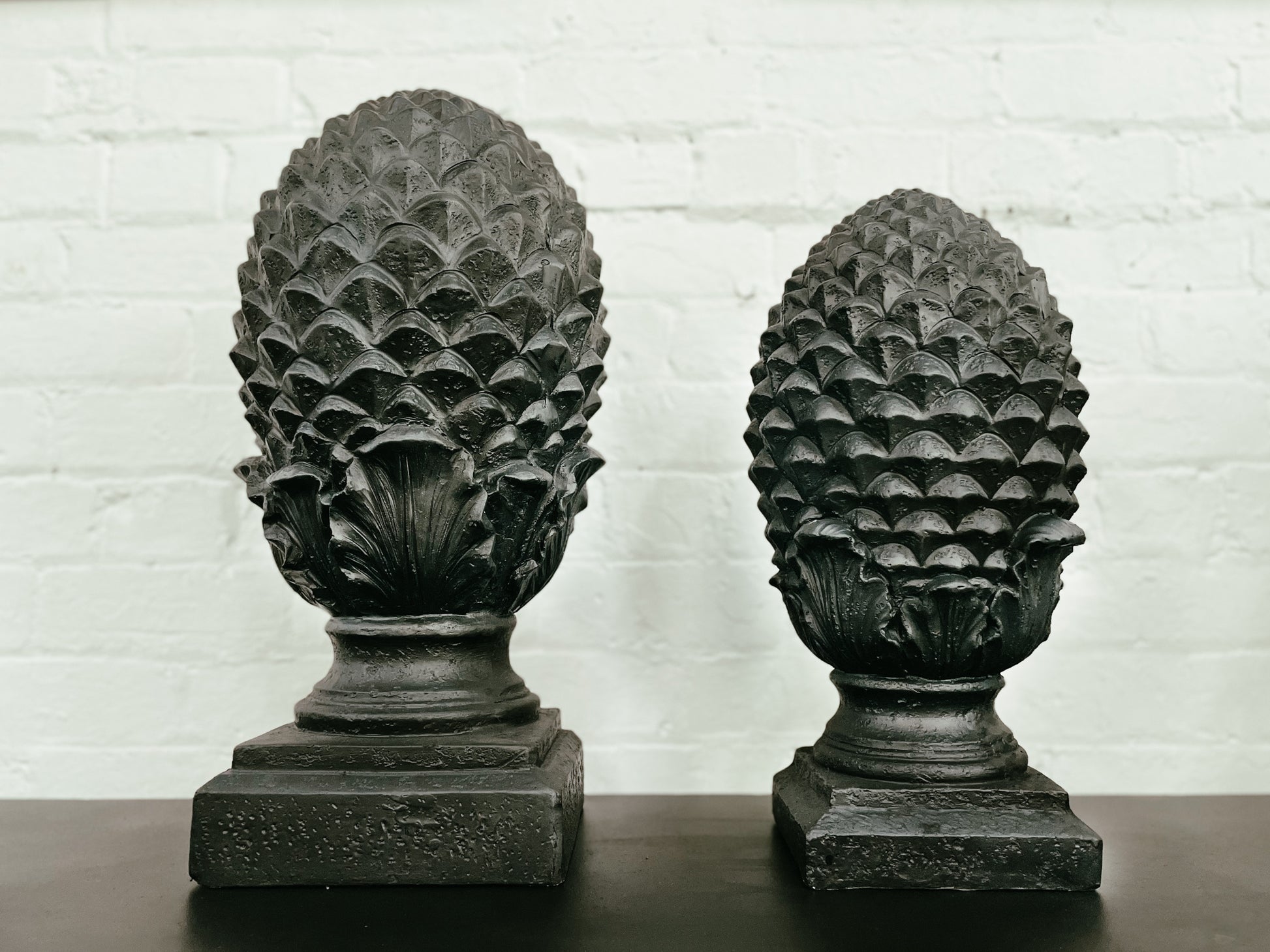 Home Decor of a small and large Pinecone, from Chambers Design