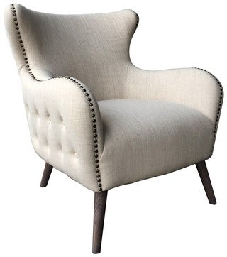 Winged occassional chair in luxurious linen and studded detailing