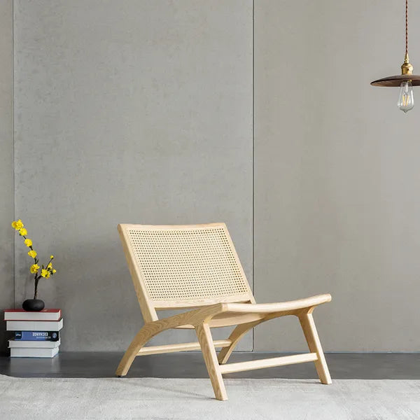 The Zara Rattan Lounger mixes two different natural materials to create patterns and textures that are strikingly different.  Natural-finished North American ash and rattan.  Dimensions: 61x76x68cm