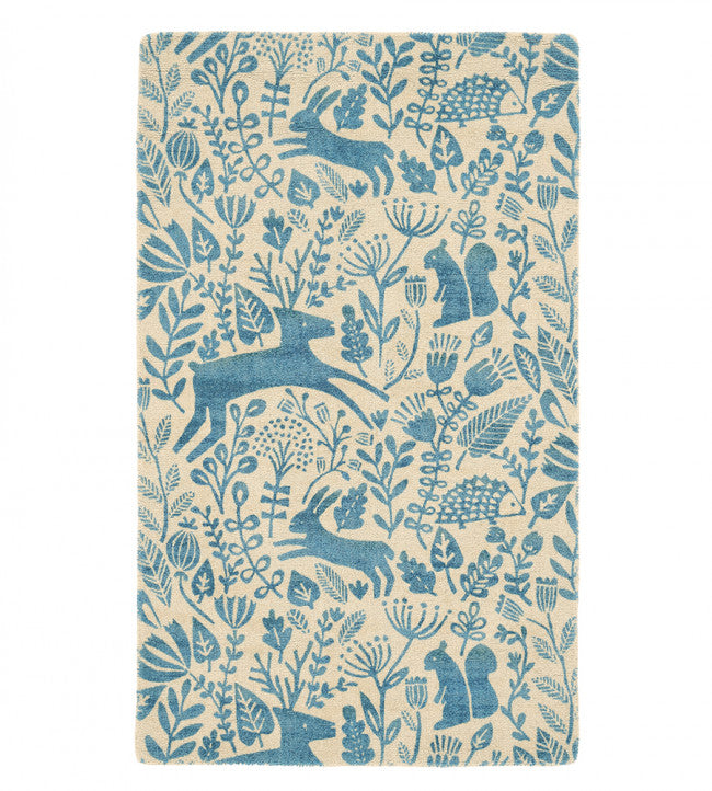 The Kelda rug will transform any interior into a welcoming and fun space. Folksy cute, delightful woodland scene blue on cream.  Available now at Chambers Design Timaru.