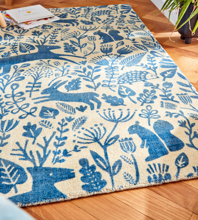 Chambers Design has curated a fun and delightful woodland scene floor rug. Blue bunnies on a cream background - simply delightful